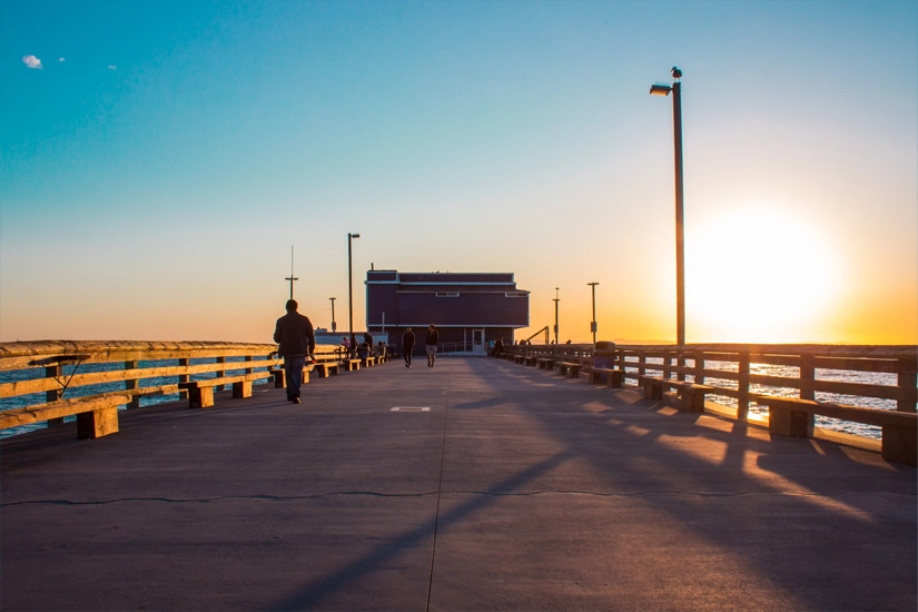 Scenic California pier at sunset near Costa Mesa, reflecting the peaceful coastal setting surrounding California Treatment Collective's men's mental health treatment center.